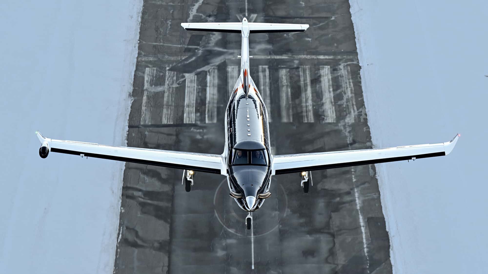 Pilatus PC-12 PRO turboprop aircraft approaching a runway